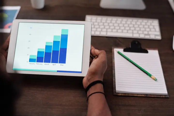 Research data and growth metrics viewed on a tablet